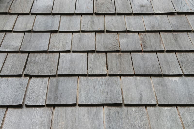 Weathered gray wood shake shingles in close-up