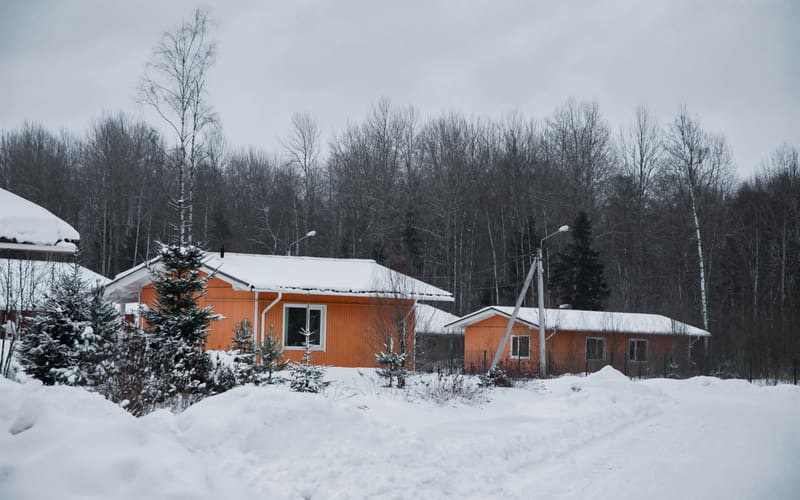 Orange houses in winter snow
