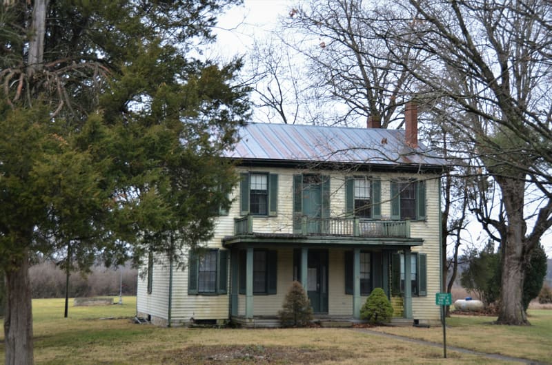 Houses with gray standing-seam metal roofs