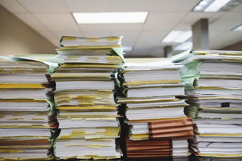 Stack of file folders on a desk