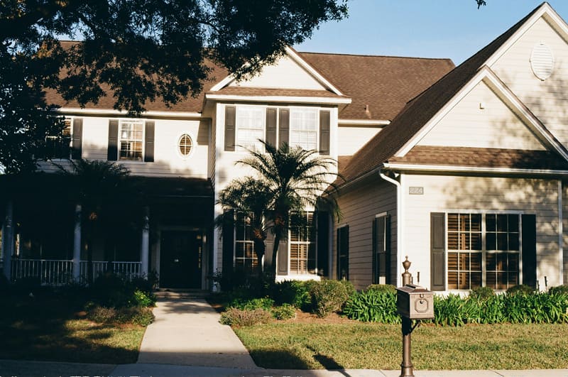 Suburban two-story home with brown asphalt shingle roof