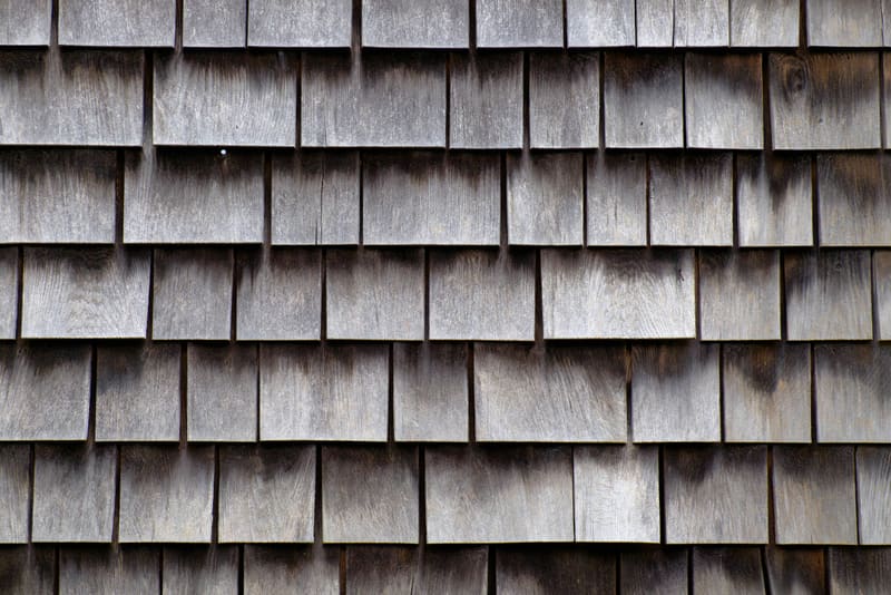 Close-up of aged, weathered wood shake shingles