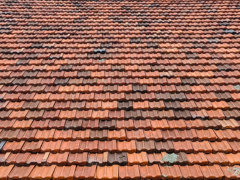White and gray concrete roof tiles in close-up
